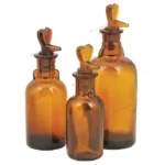 BOTTLE DROPPING T.K. PATTERN, AMBER COLOUR